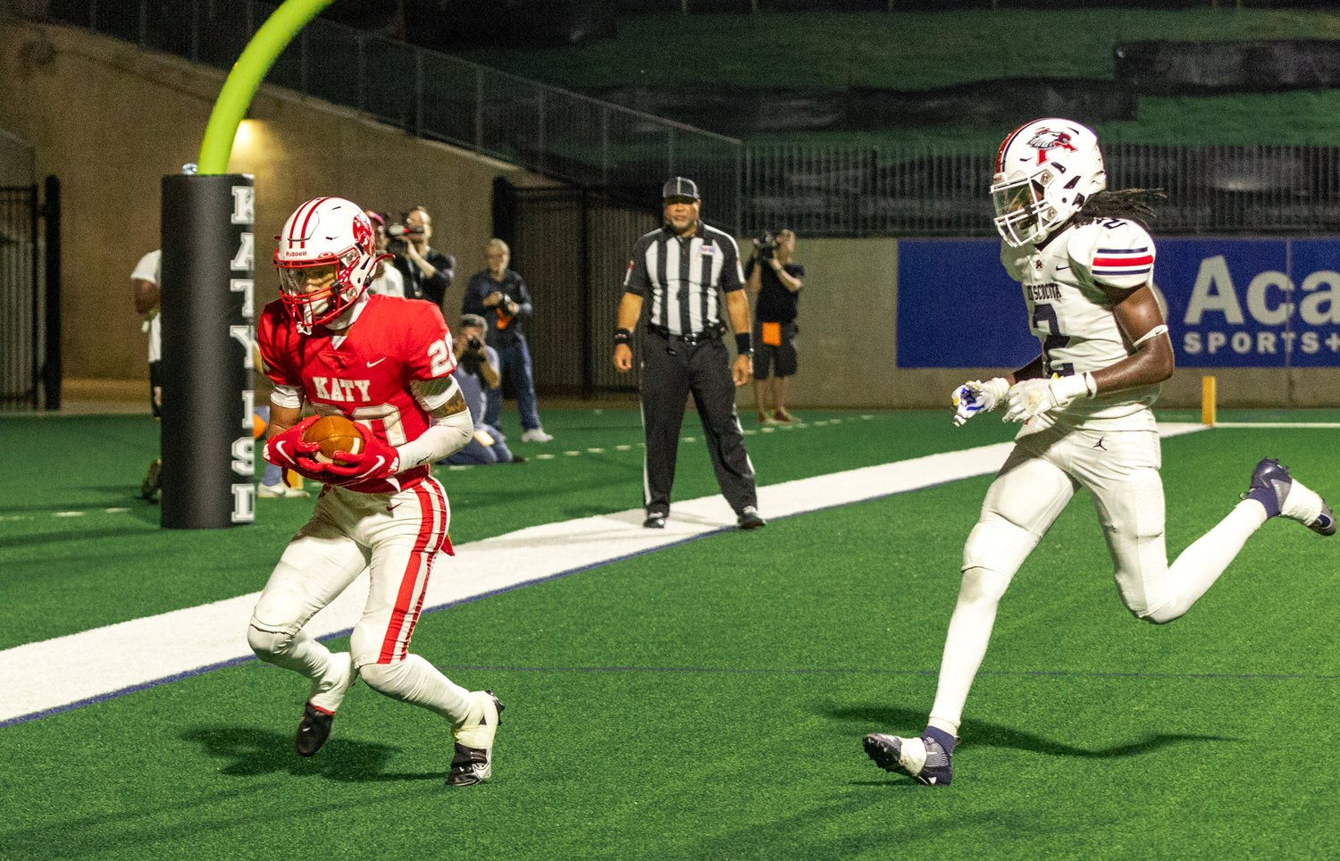 Katy’s Micah Koenig catches a touchdown pass during Friday’s game between Katy and Atascocita at Legacy Stadium.